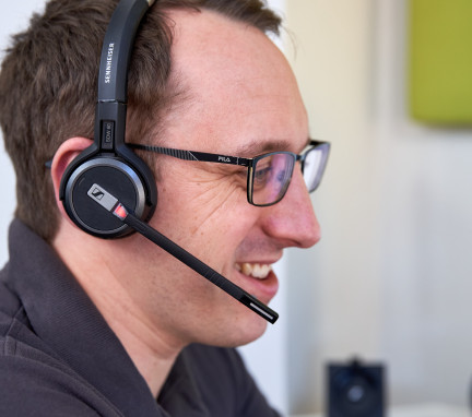 Man Using Headset on an Audio Visual Support Call