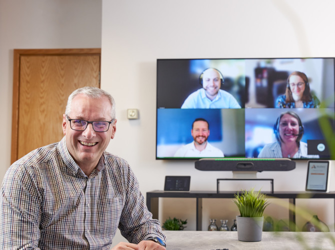 Multiple People on a Video Conference Call in a Meeting Room