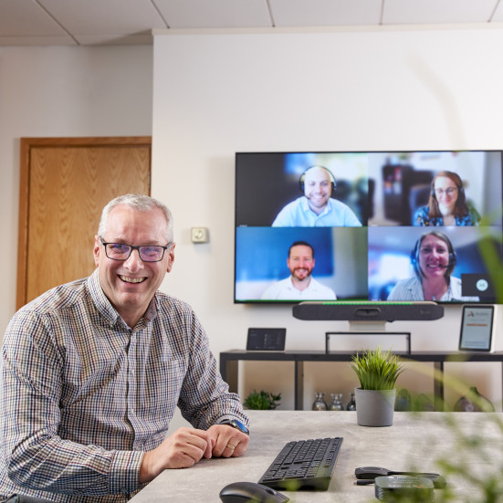 Multiple People on a Video Conference Call in a Meeting Room