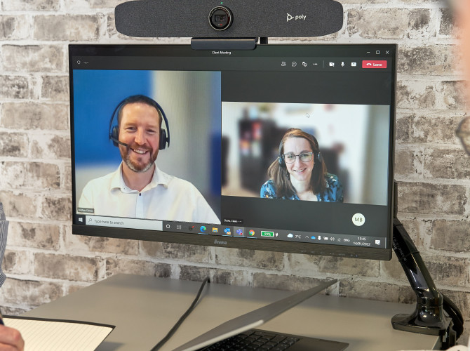 People on a Video Conference Call in a Huddle Space